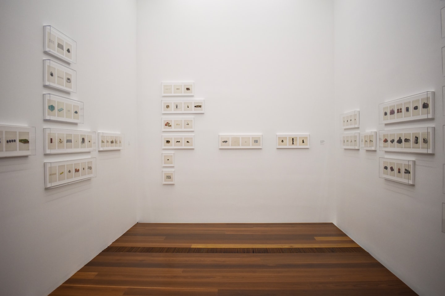 Contemporary art pieces displayed on clean white gallery walls.